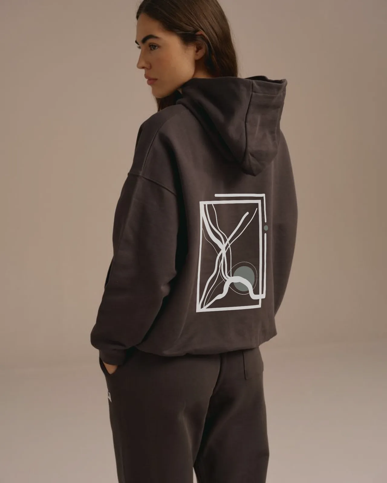 Chapter charcoal hoodie with sage symbol artwork